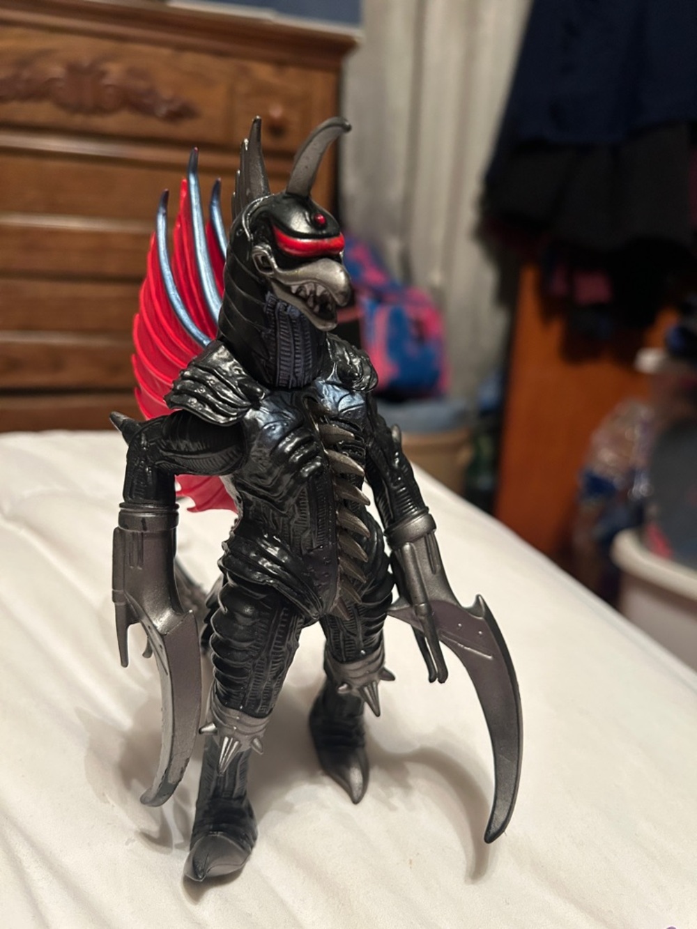 Black and Red Monster Action Figure with Winged Back